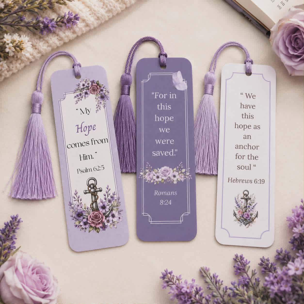 Three purple bible verse bookmarks with tassels on a floral background