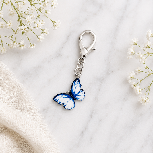 Blue and white butterfly Christian bag charm with silver lobster clasp