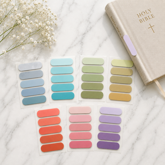 Sticky Page Tabs on a marble surface with a Bible and flowers.